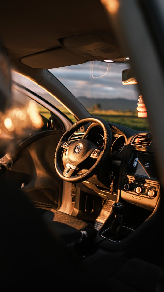 Sunlit car interior at sunset in Merzifon, Türkiye.